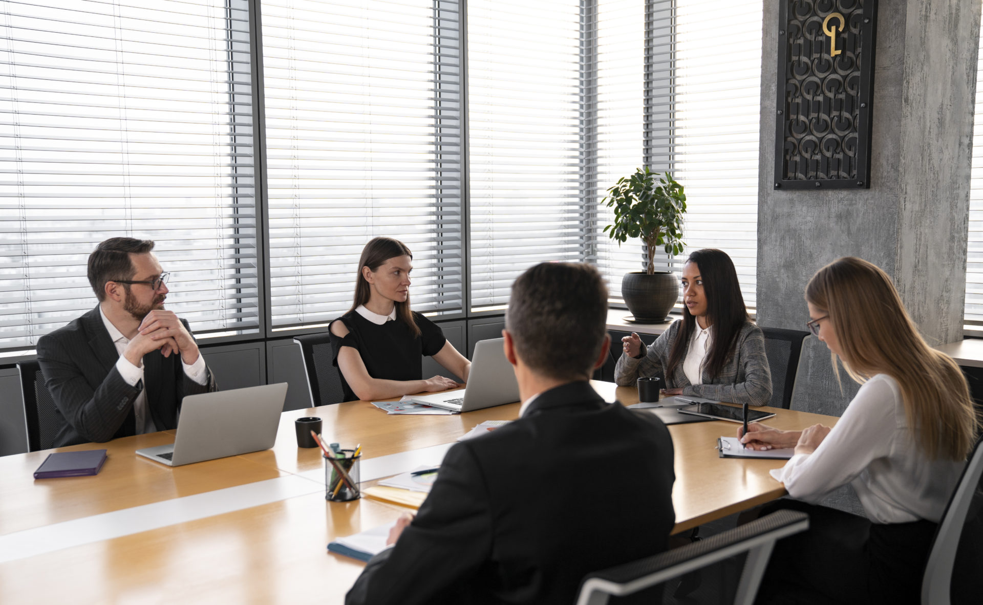 medium-shot-people-sitting-table